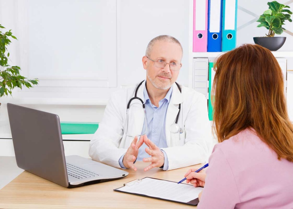 Doctor discussing treatment options for insurance